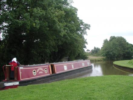 Odyssey is leaving the Whitchcurch arm, heading for Llangollen: the lift bridge on the main line is out of the picture to the right : Odyssey at Whitchurch Branch Junction (Taken on Monday 12th July 2004)<br />